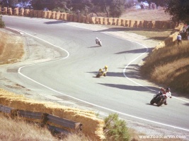 The Best Turn Ever (6a-6b): This view from the outside of turn 7 (now turn 9) is lost to the bridge move. It is beyond my comprehension why anyone would ruin the view of one of the most famous turns in the world of racing to reposition a foot bridge.